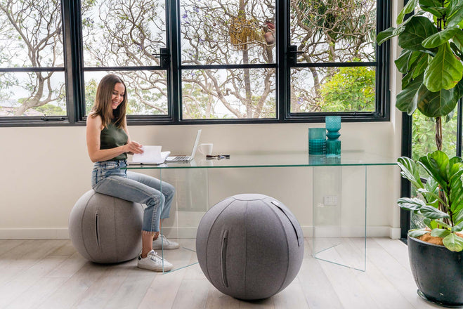 Sitting on a yoga ball working from home